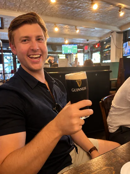 Mark Dowdall with a pint of Guinness at a New York bar